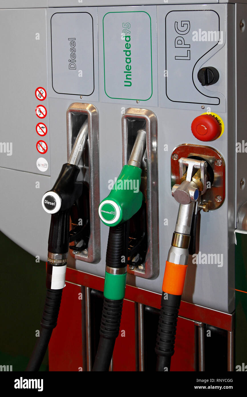 Petrol diesel and auto gas nozzles at fuel station Stock Photo Alamy