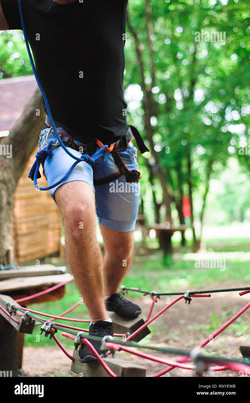 Hiking in the rope park two young people Stock Photo Alamy