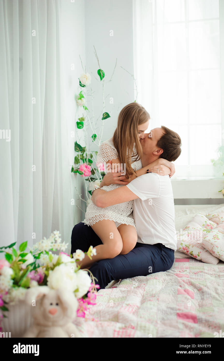 a young husband and wife hug each other Stock Photo - Alamy