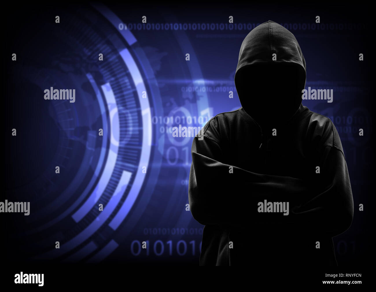 Hooded computer hacker stealing information Stock Photo