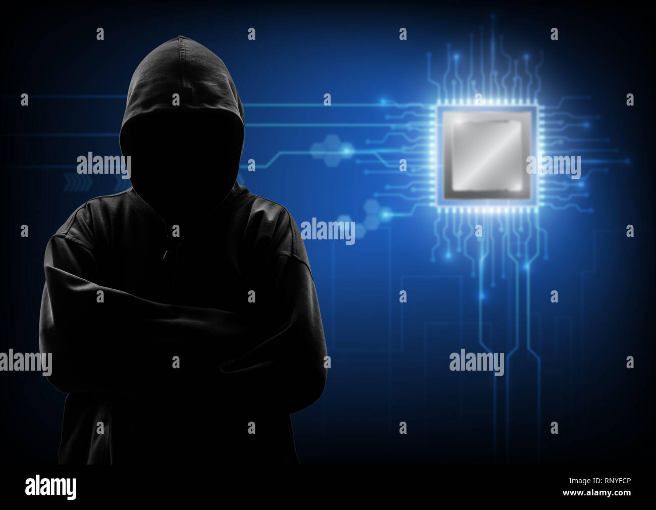 Hooded computer hacker stealing information Stock Photo