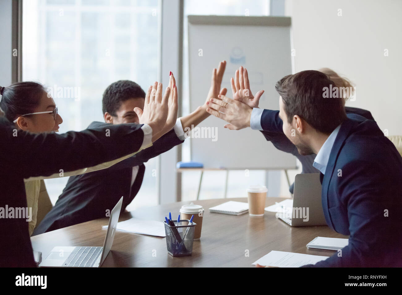 Excited business team give high five celebrate corporate success Stock ...