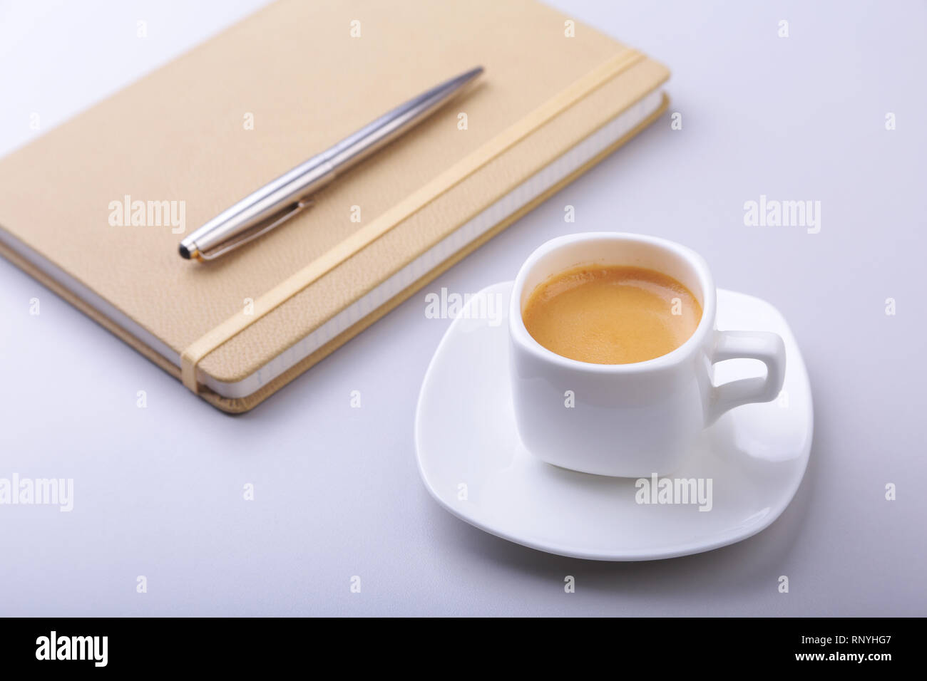 office table with notebook, computer keyboard,, cup of coffee, tablet pc. copy space. Stock Photo