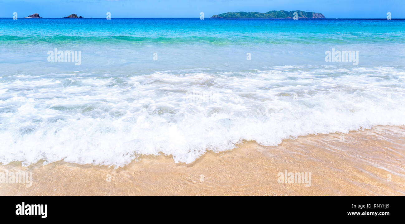 Beautiful amazing gold colored sandy beach with soft waves isolated ...