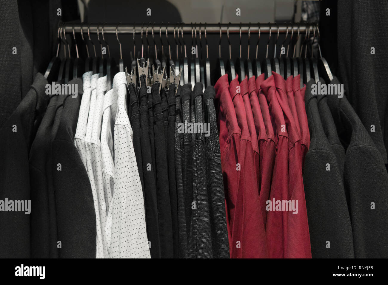 Classic Men Clothes Suits Shirts And Pants On The Racks In