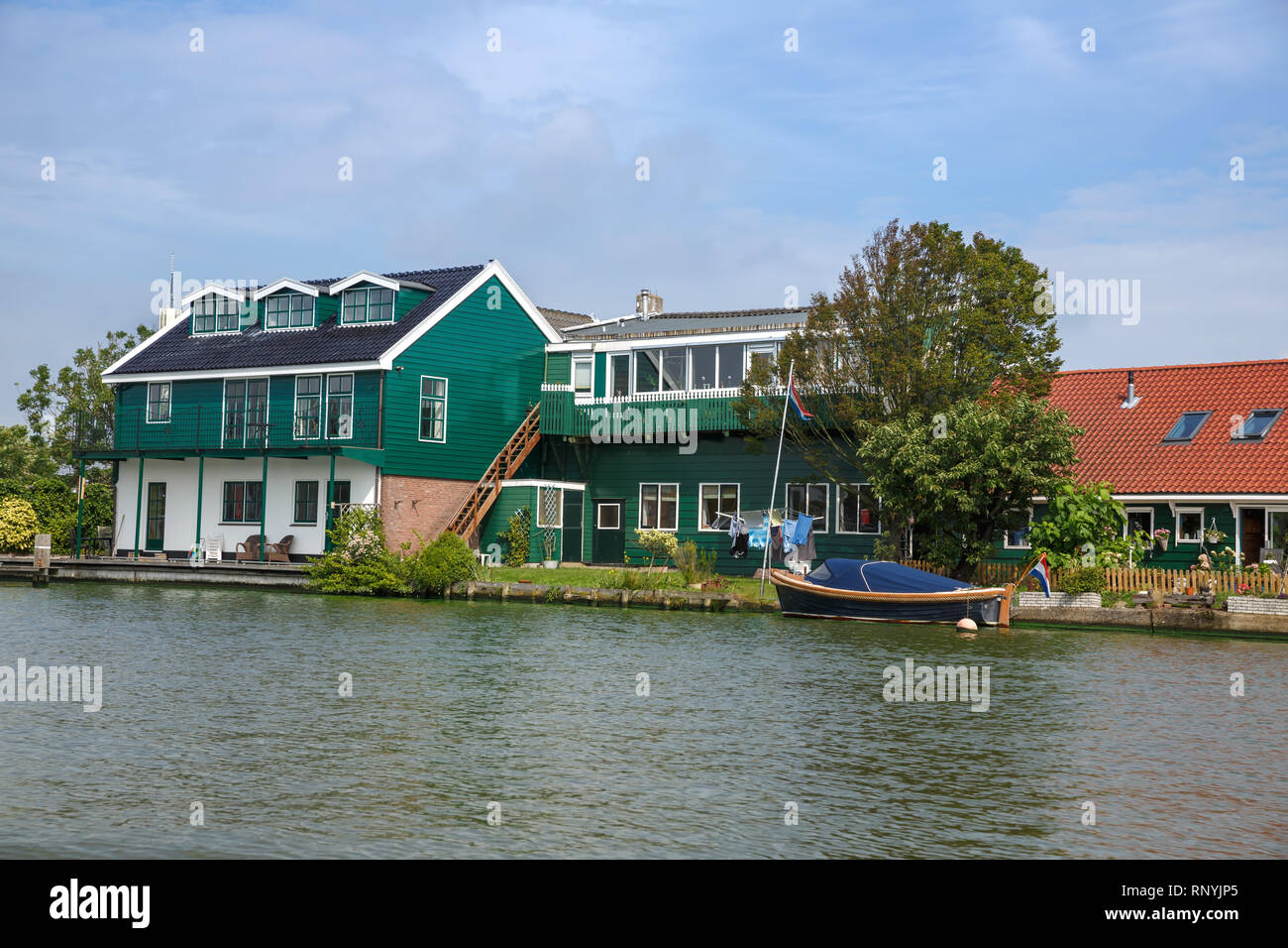 Zaanse Schans village with river and houses in The Netherlands. Stock Photo