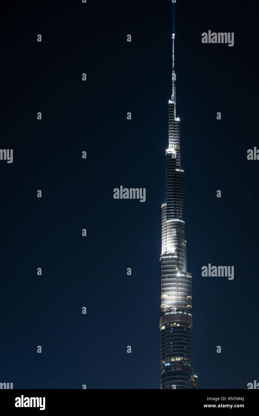 DUBAI, UAE - February 17, 2018: Deatil of Burj Khalifa top at night, tallest building in the world, Dubai, UAE Stock Photo