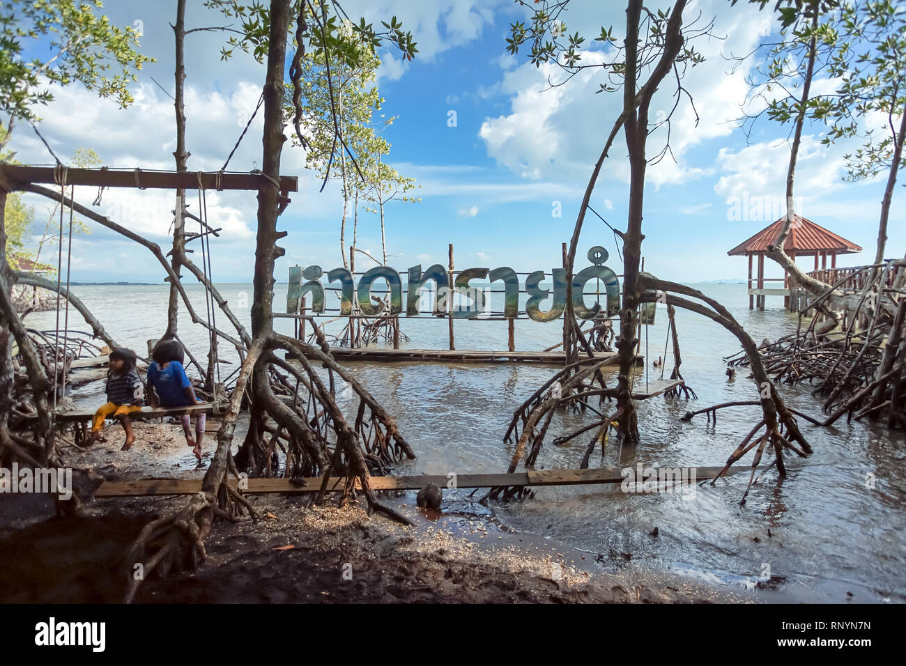 Trad, Thailand - December 01, 2018: Check in point of black sand beach with Thai post 'Had Sii Dam' in Trad province, Thailand. This place is famous m Stock Photo