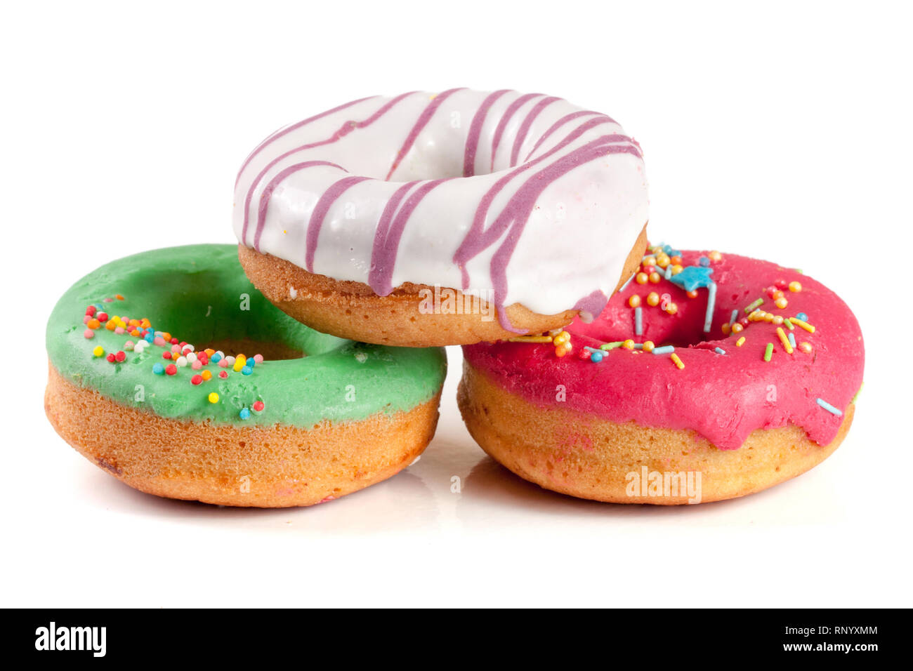 three glazed donut isolated on white background Stock Photo - Alamy