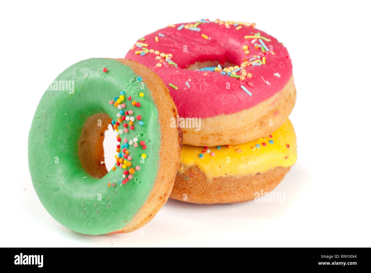 three glazed donut isolated on white background Stock Photo - Alamy
