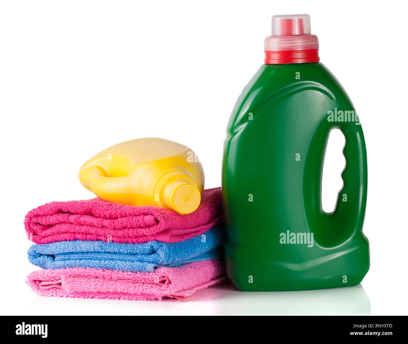 bottle laundry detergent and conditioner or fabric softener with towels