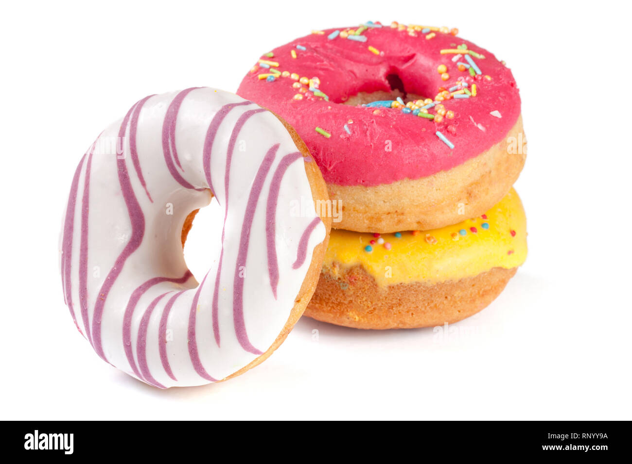 three glazed donut isolated on white background Stock Photo - Alamy