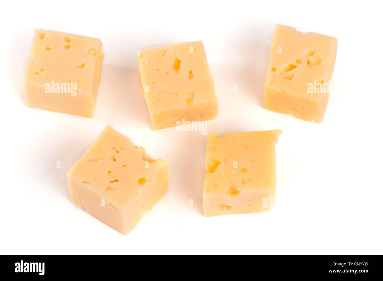 cheese cut into cubes isolated on white background Stock Photo Alamy
