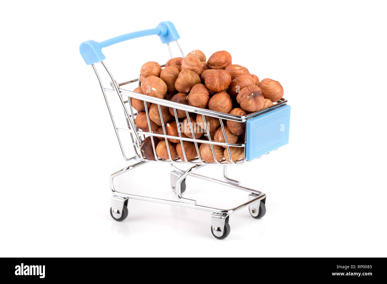 hazelnut in a shopping cart isolated on white background. Stock Photo