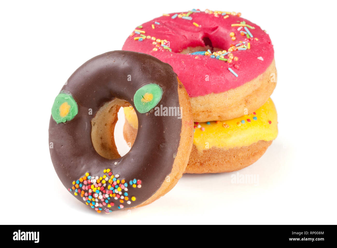 three glazed donut isolated on white background Stock Photo - Alamy