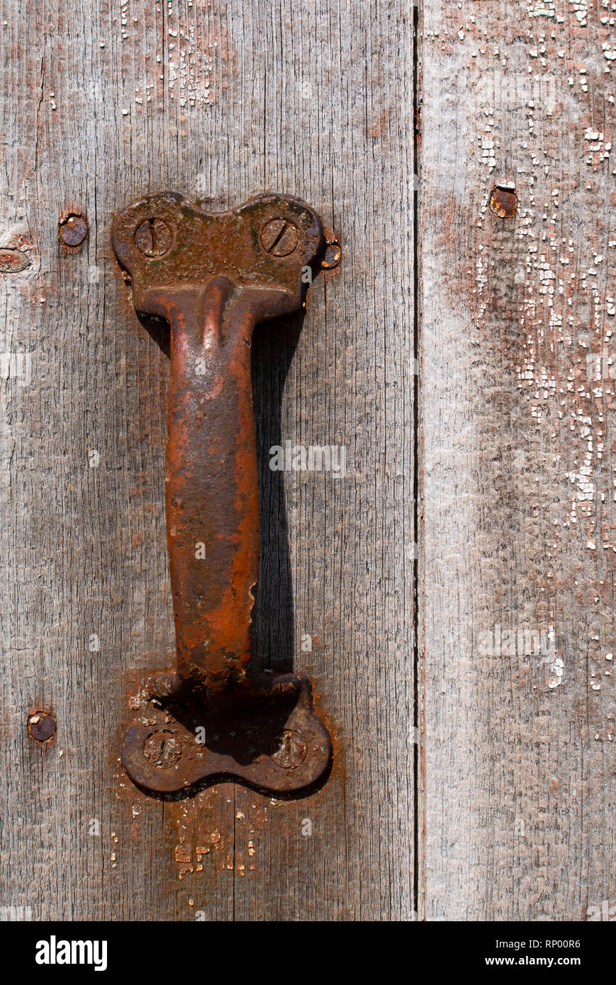 Rusted handles on old barn door. Stock Photo