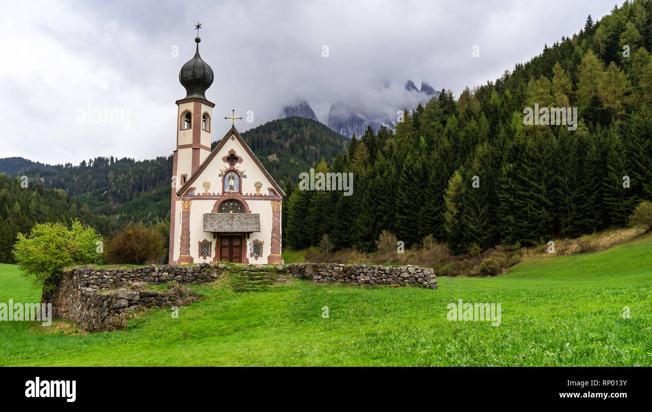 Beautiful landscape in the Alps. Best alpine place, St Johann Church, Santa Maddalena, Val Di Funes, Dolomites, Italy Stock Photo