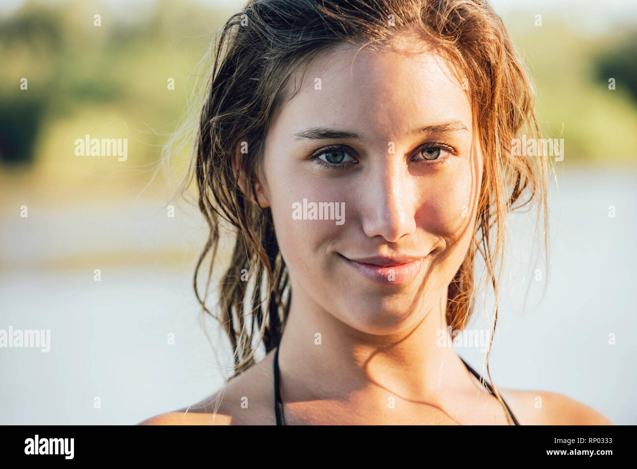 Portrait of young woman standing outdoors Stock Photo