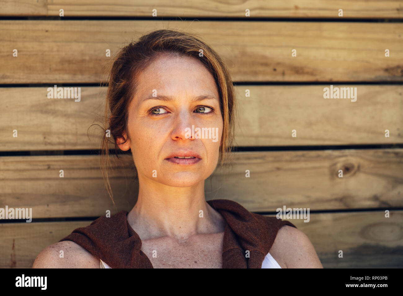 Mature woman sitting outdoors hi-res stock photography and images - Alamy