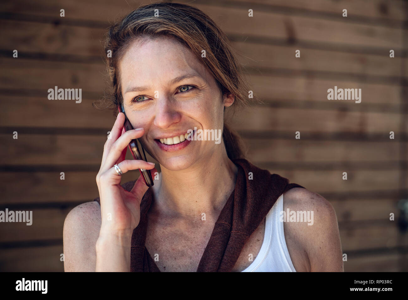Mature woman talking on smart phone Stock Photo - Alamy