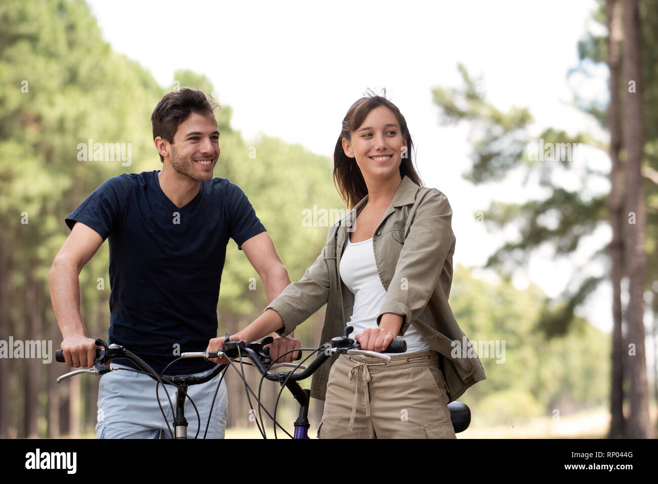 Young couple resting on bicycles Stock Photo