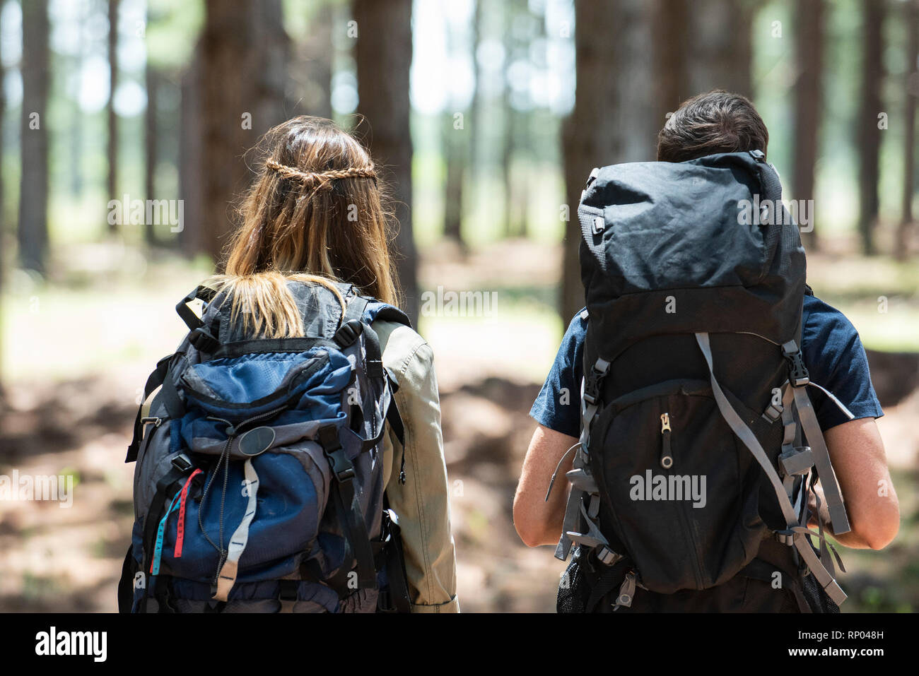 Young couple hiking in forest Stock Photo