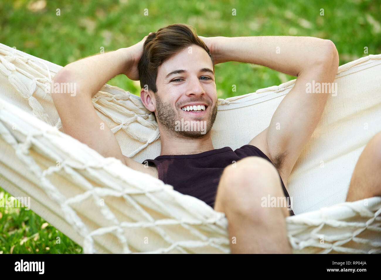 Young man relaxing in hammock Stock Photo