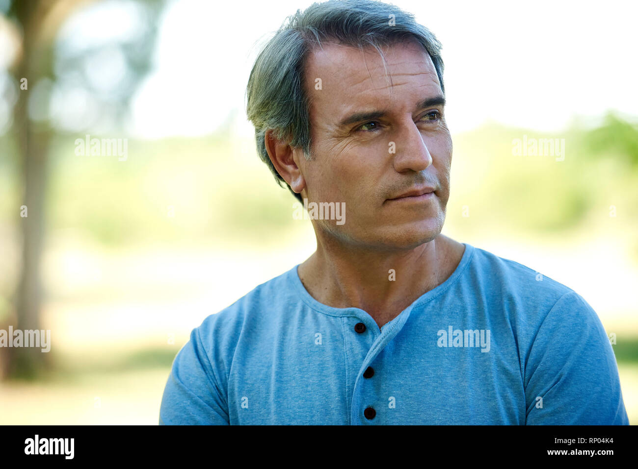 Close-up of a mature man standing outdoors Stock Photo