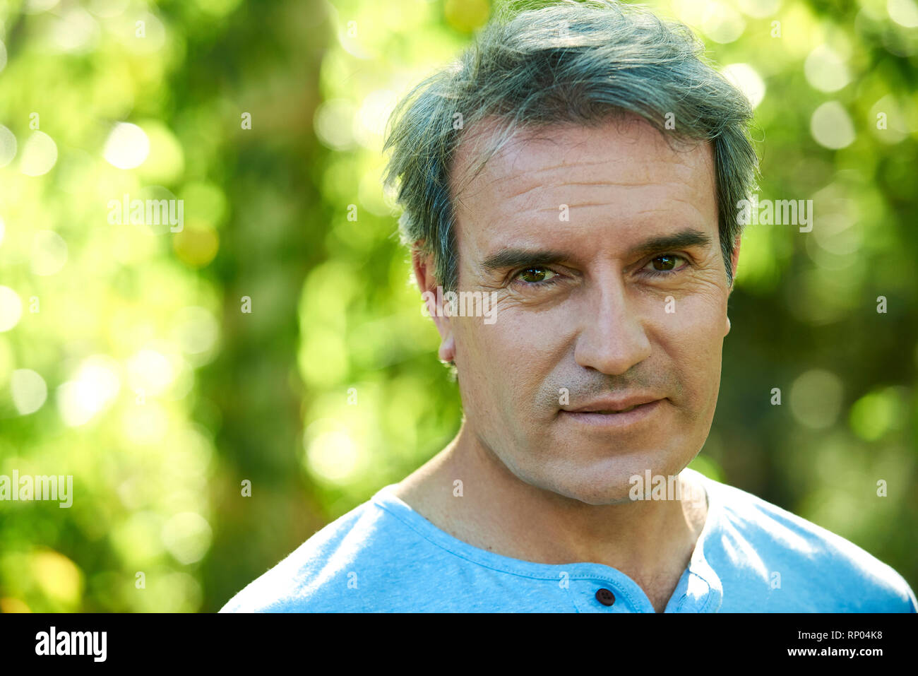 Close-up of a mature man standing outdoors Stock Photo