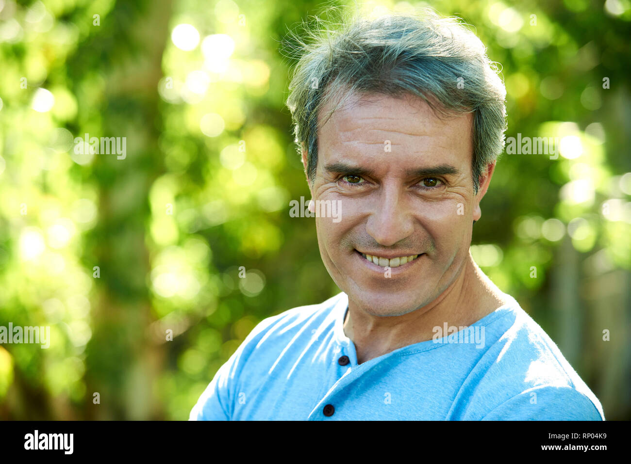 Close-up of a mature man standing outdoors Stock Photo