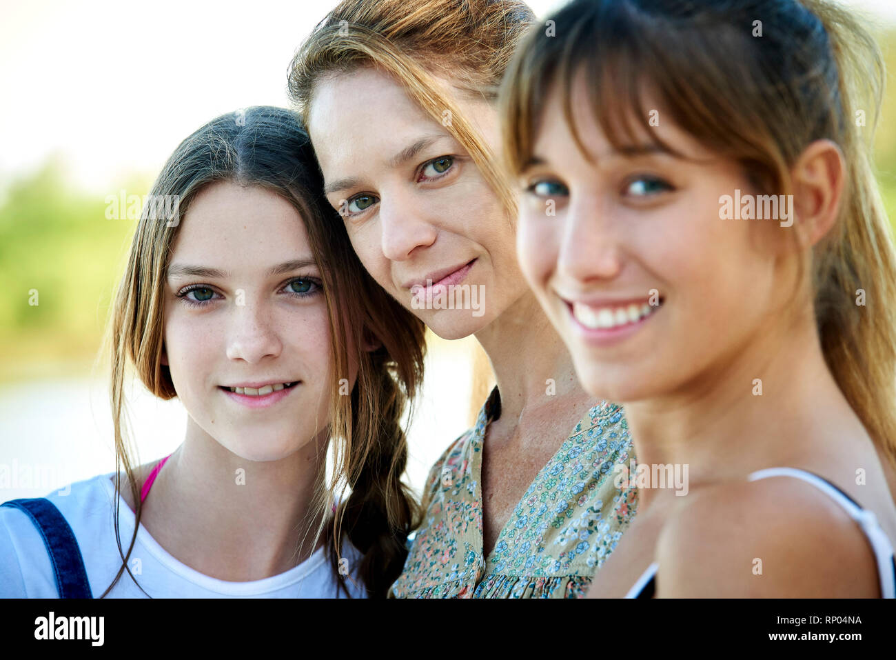 Family standing outdoors Stock Photo