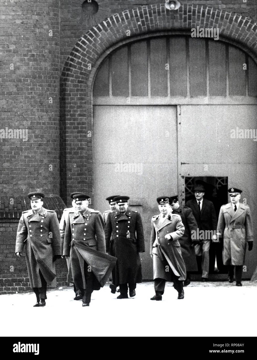4/1/1962 -  The Senior Soviet Commander Lt. Col. Solowjew (Second From Left) Arrived at The Spandauer War Criminal Prison On April 1, 1962. On This Day Americans Are Relieving Soviet Guards of Their Duty at The Prison. Lt. Col Solojew Entered The Prison Over The British Sector Since He Was Denied Access By Americans to West Berlin On Their Border. Stock Photo