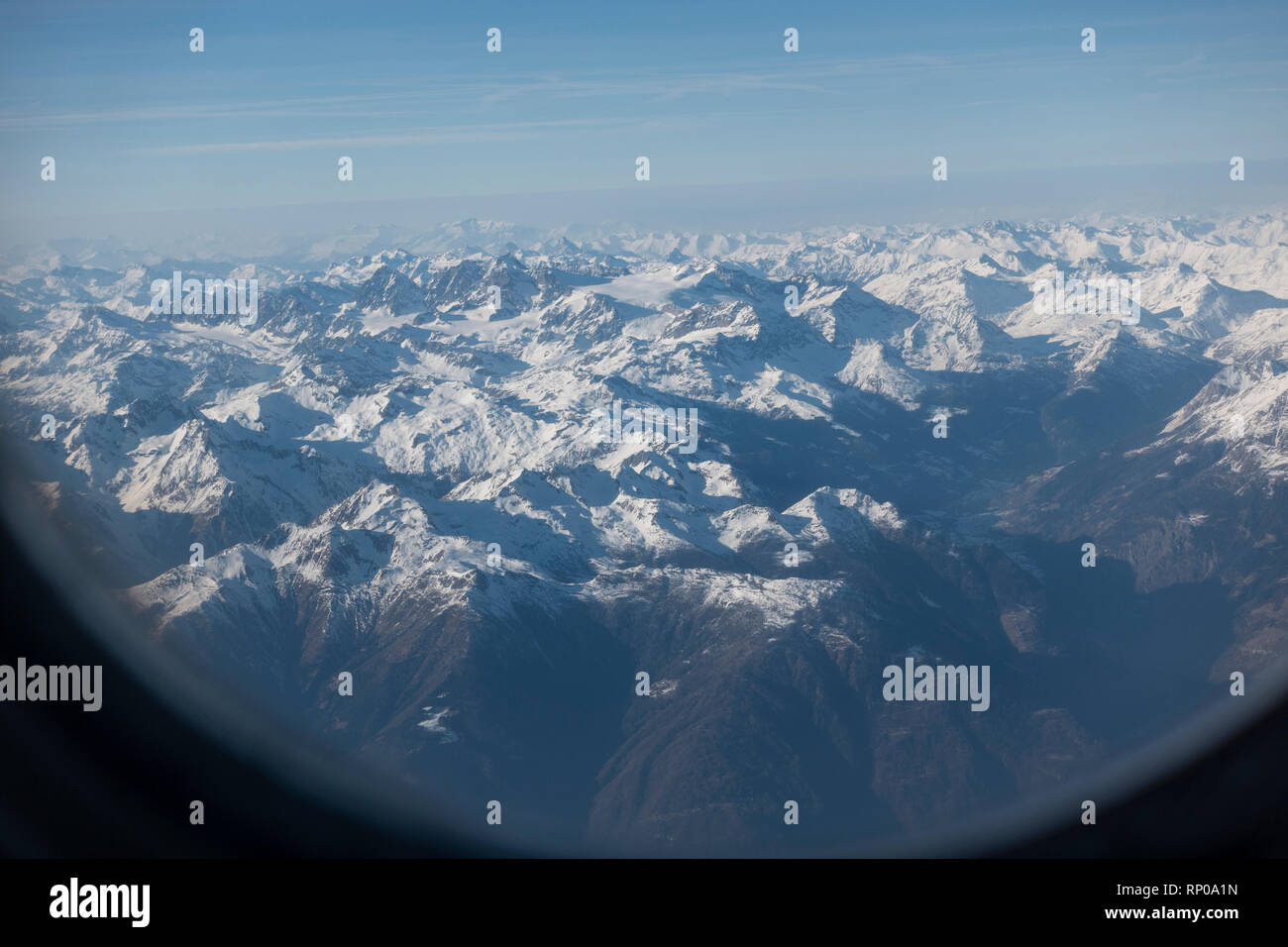 Alps Mountains seen from the window of Pobeda  (Victory) aircraft Stock Photo