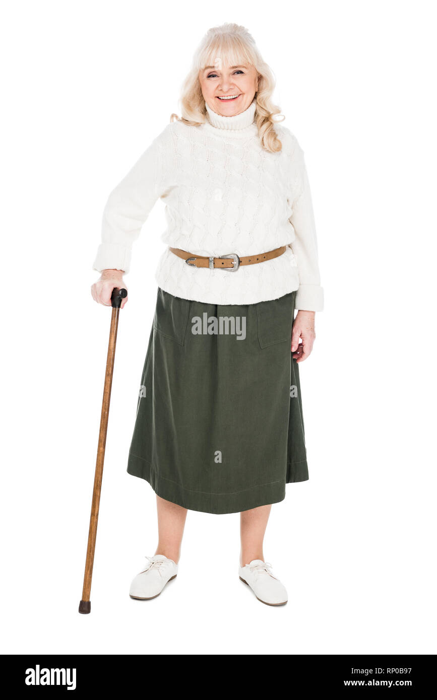 happy retired woman standing with walking cane isolated on white Stock Photo