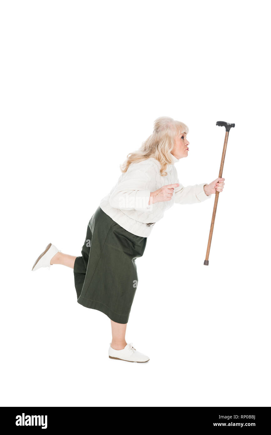 senior woman running with walking cane isolated on white Stock Photo