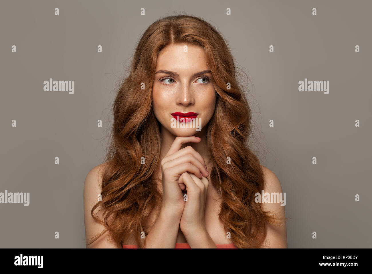 Beautiful woman red long hair hi-res stock photography and images - Alamy