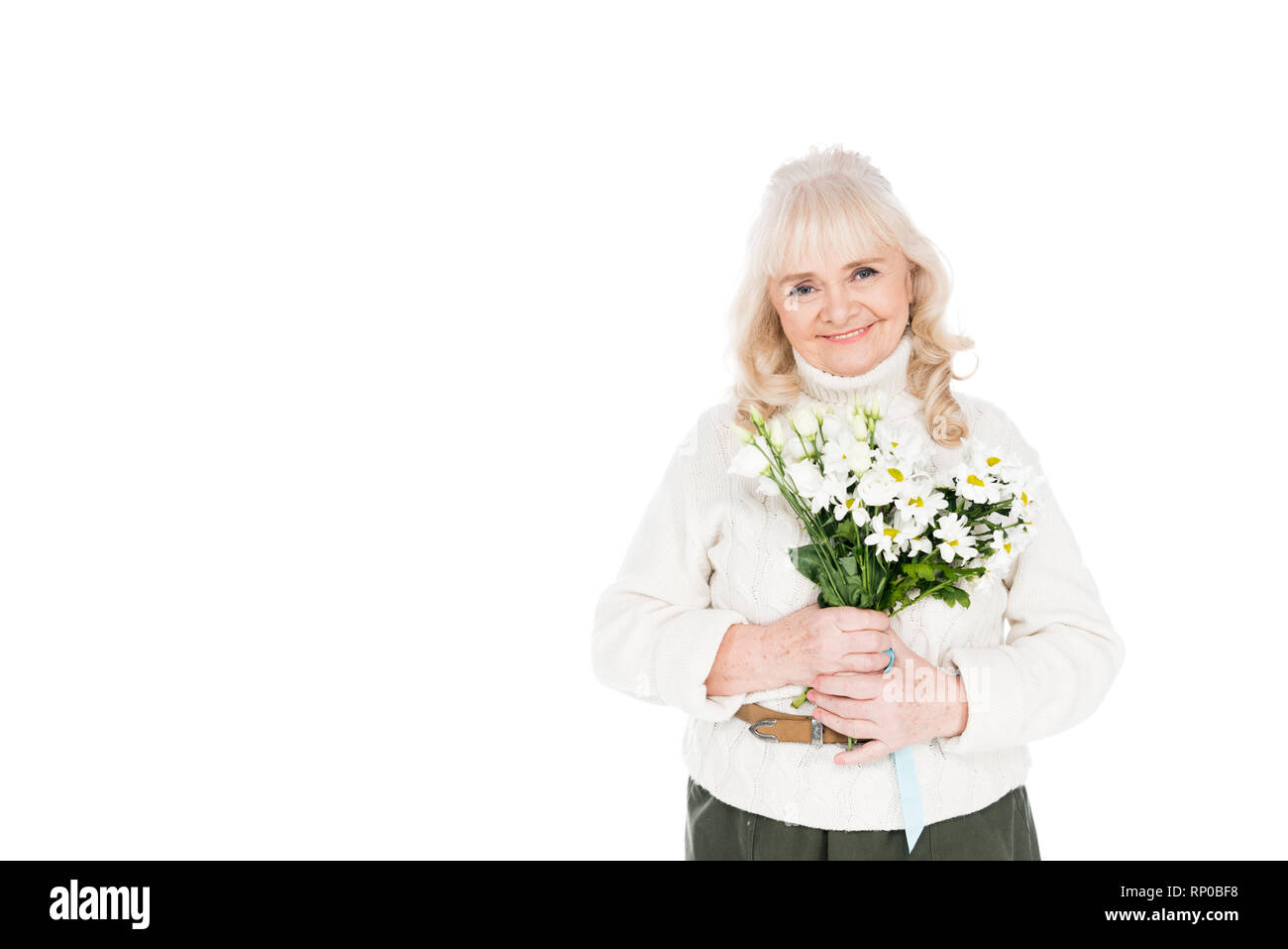smiling senior woman holding flowers in hands isolated on white Stock ...