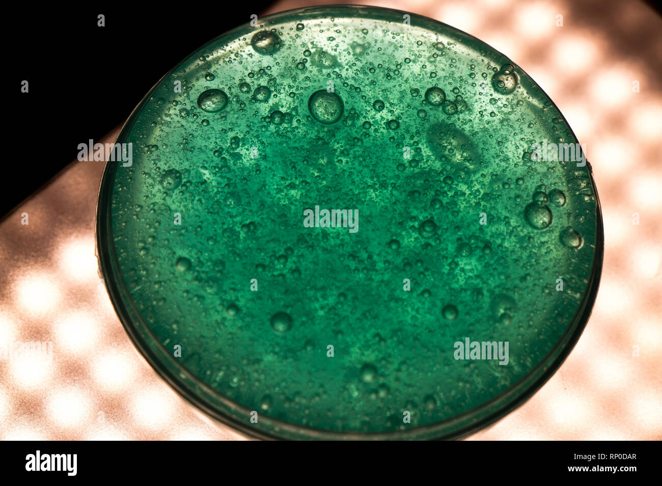 Bowl of slime on light scene Stock Photo - Alamy