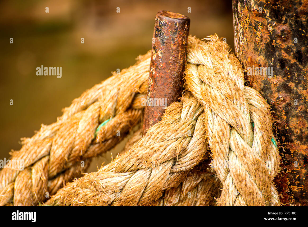 Mooring line of a trawler at an iron hook Stock Photo - Alamy