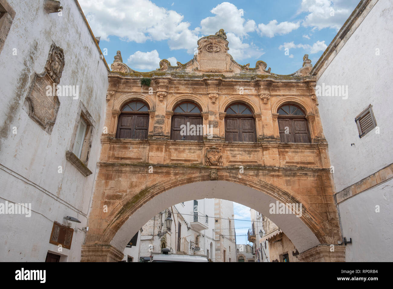 Arco Scoppa of Ostuni, La Citta Bianca (The White Town) Apulia. The Scoppa arch of bishop's palace front of the cathedral. Ostuni, Puglia, Italy Stock Photo