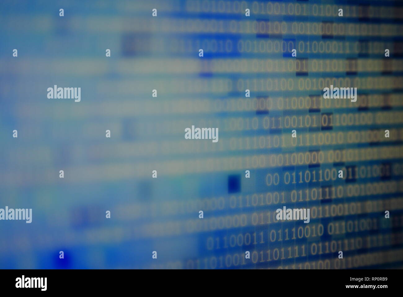 computer block of binary code on blue pixel background. light and dark ...