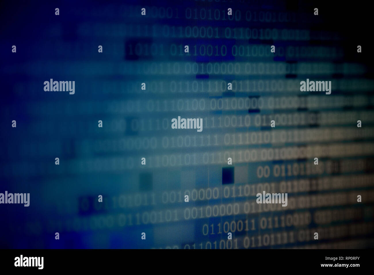 computer block of binary code on blue pixel background. light and dark ...
