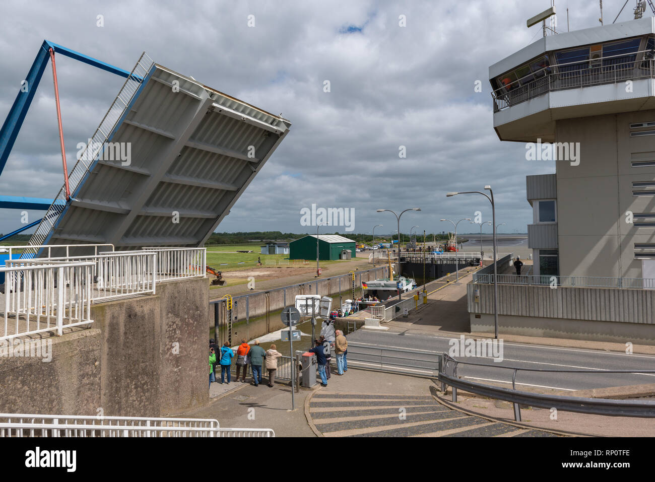 Flood barrier of the Eider River avoiding the North Sea flooding the inland marshes, Wesselburenkoog, Dithmarschen, Schleswig-Holstein, Germany Stock Photo