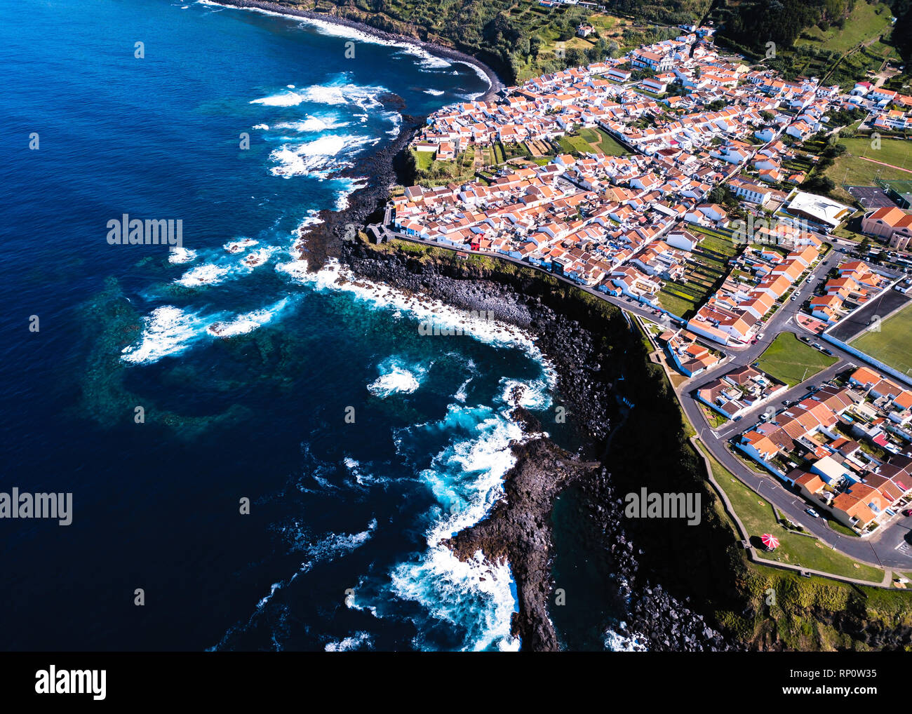 Top view the ocean surf on reefs coast of San Miguel island, Azores ...