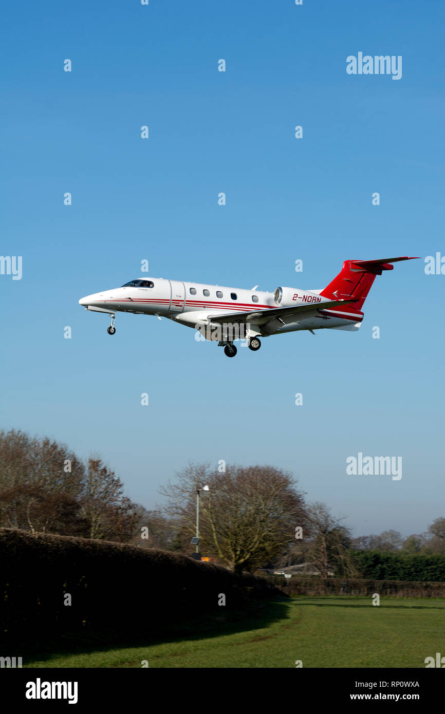 Embraer Phenom 300 landing at Wellesbourne Airfield, Warwickshire, UK