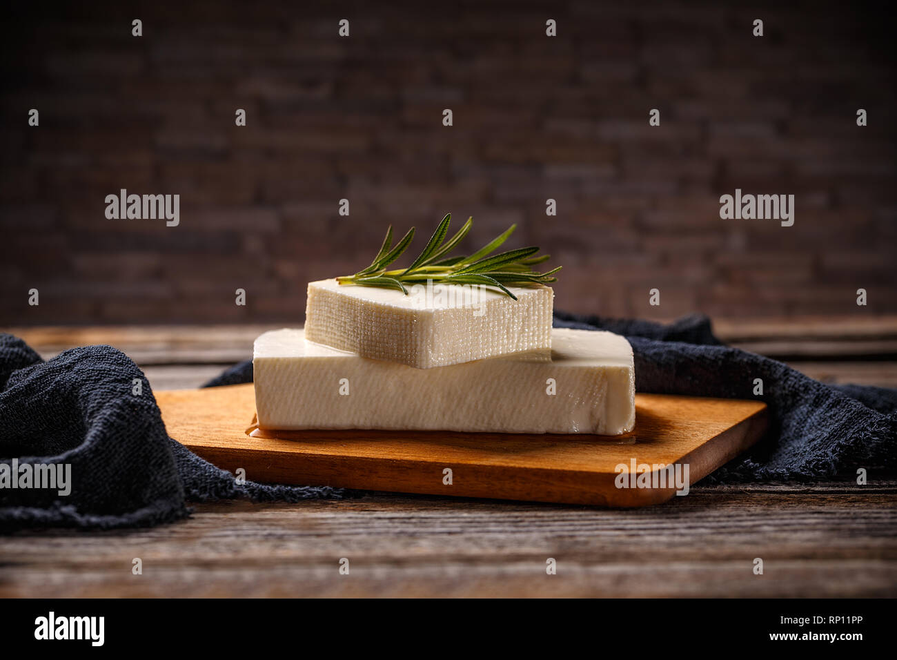 Greek feta cheese block on wooden board Stock Photo Alamy