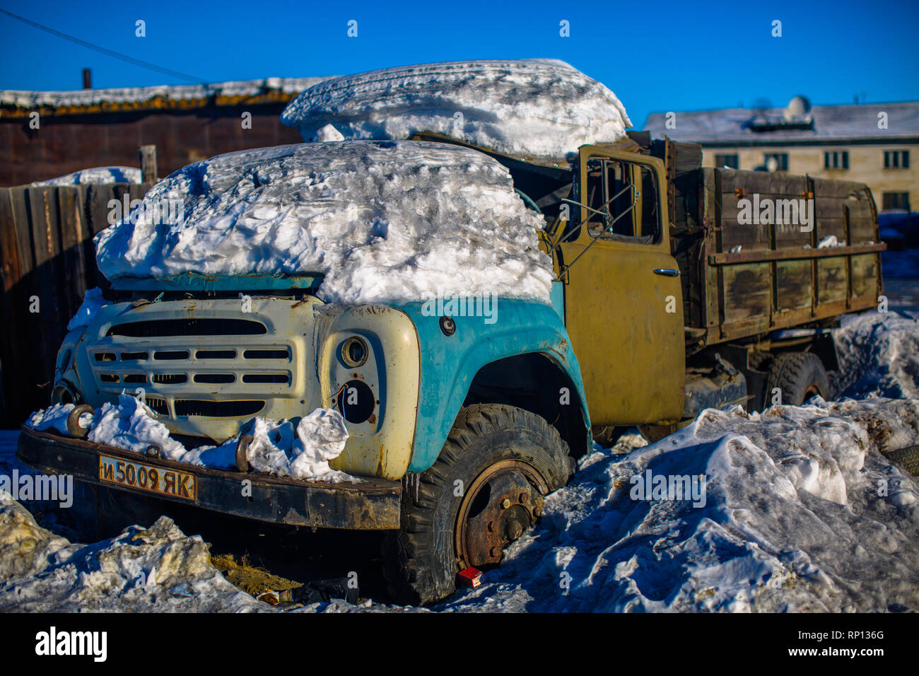 A 1968 Ford F250 abandoned in the centre of Batagay town, Russia. Stock Photo