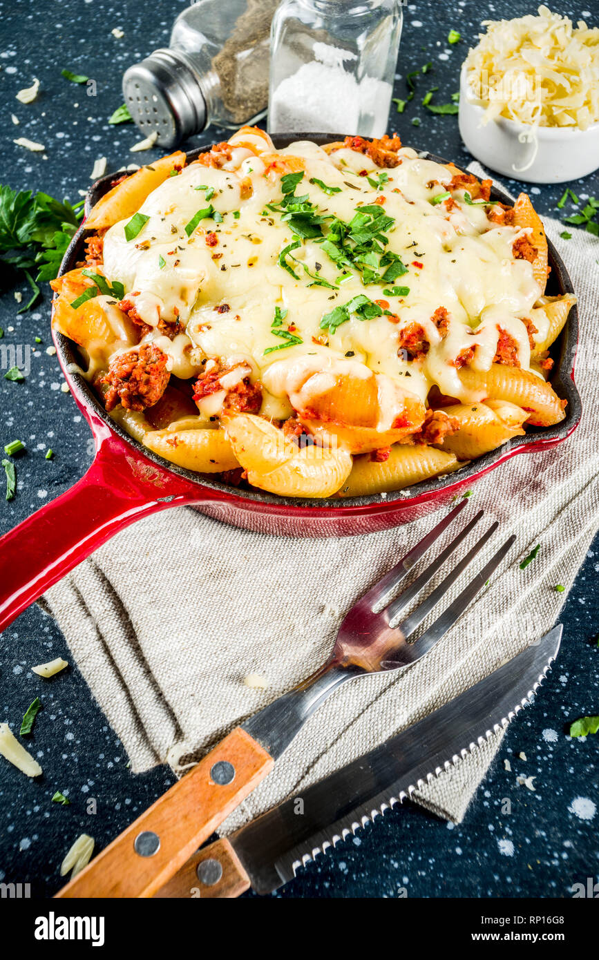 Baked creamy pasta casserole, mac and cheese with minced meat, italian