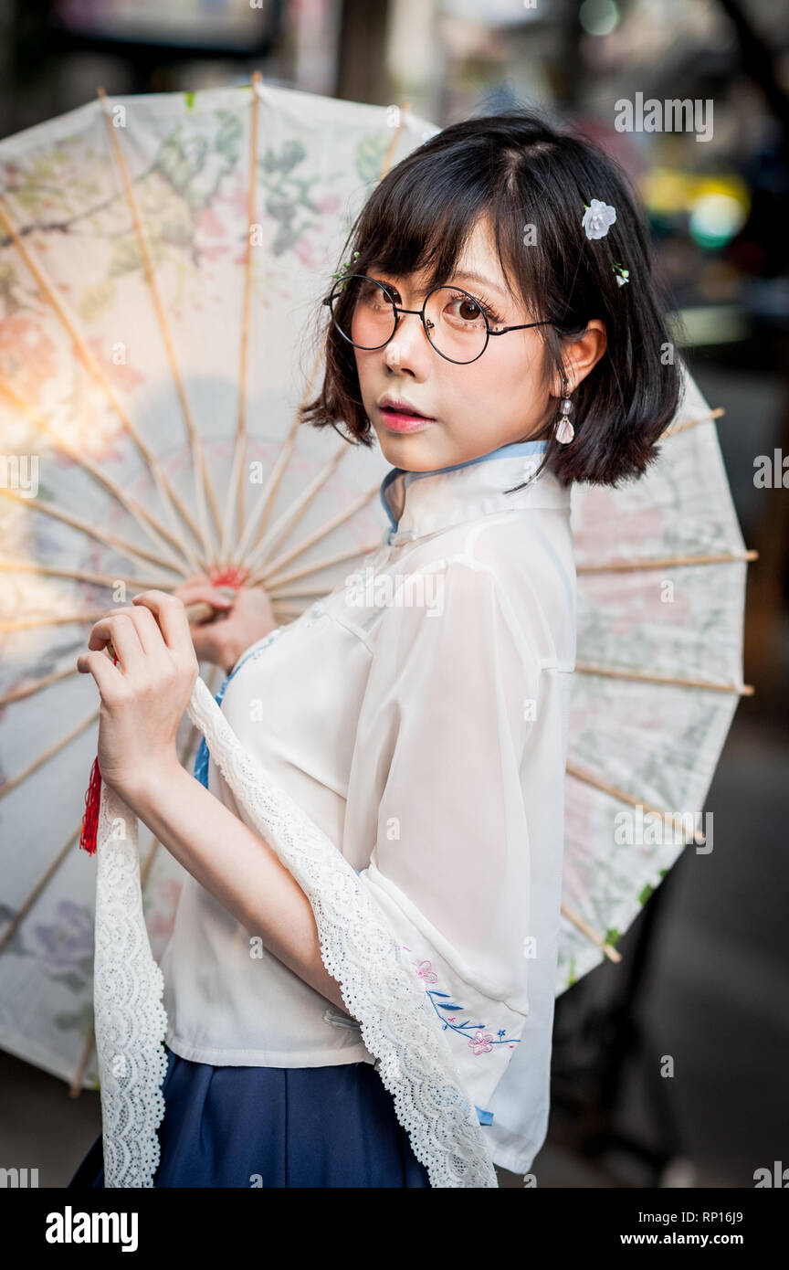 Images of the incredible Thai Cosplay girls and boys at the Japan Expo 2019 in Bangkok Thailand.Model plays innocent Japanese style girl with parasol. Stock Photo