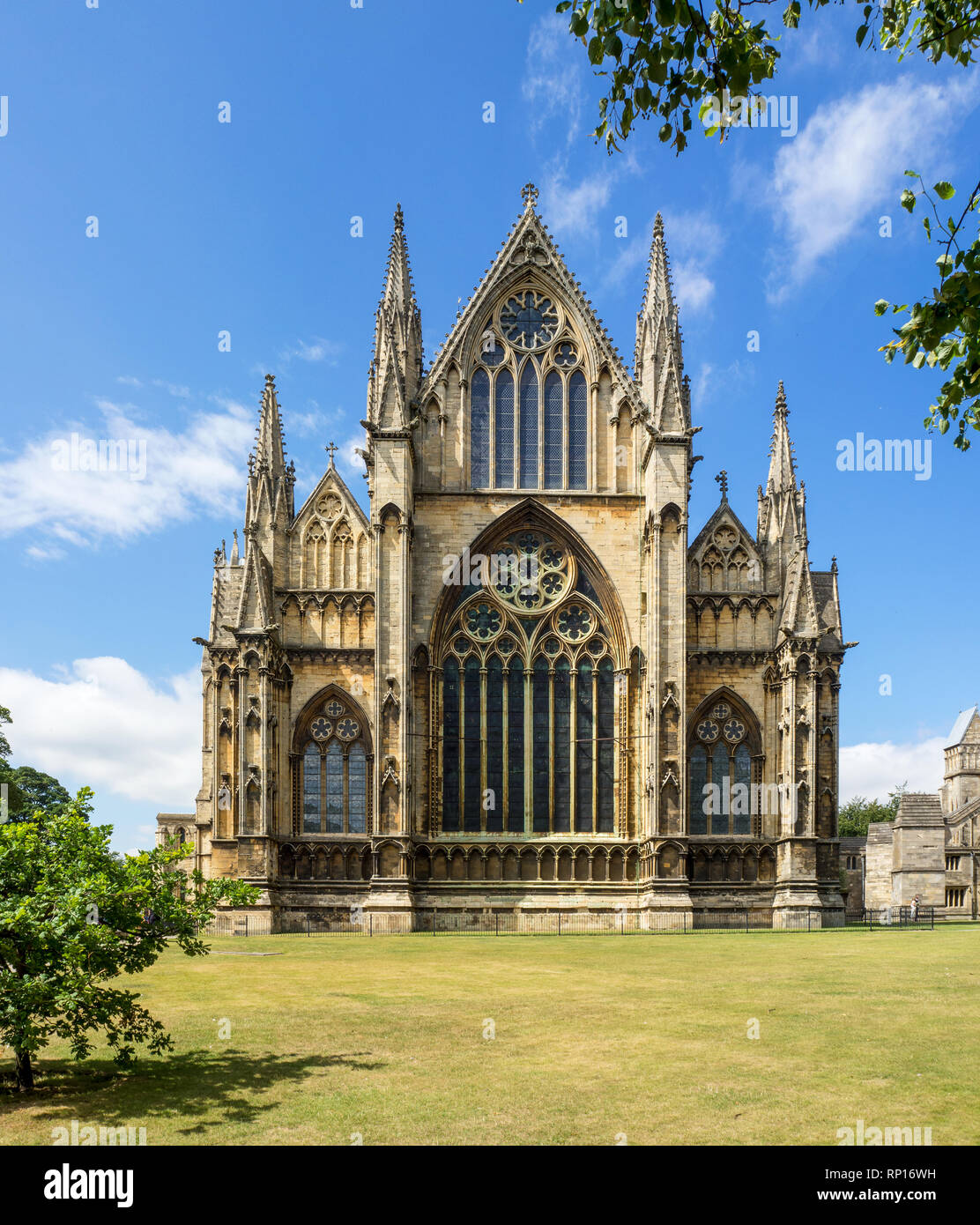 Gothic cathedral in Lincoln, Lincolnshire, England, UK. Presbytery with rosettes and lancet windows with stained glass. Stock Photo